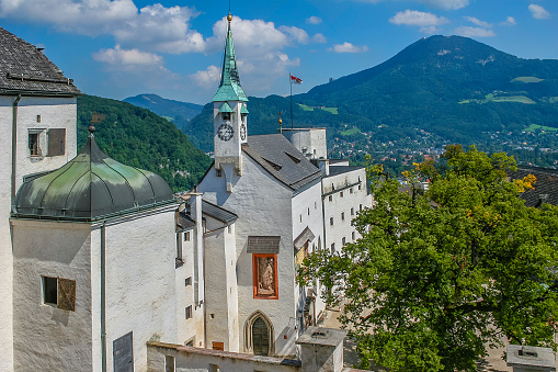 Salzburg, Austria - August 30, 2005: The Hohensalzburg Fortress is a citadel located on the top of a hill overlooking Salzburg. It was built in 1077 by Archbishop Gebhard and enlarged in later centuries to become self-sufficient, able to defend the prince-bishops who lived there. 