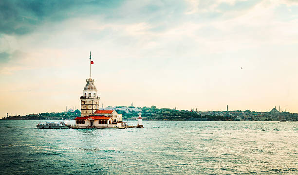 Maiden's Tower / Kiz kulesi The Maiden's Tower , also known in the ancient Greek and medieval Byzantine periods as Leander's Tower, sits on a small islet located at the southern entrance of Bosphorus strait 200 m off the coast of Uskudar in Istanbul, Turkey. maidens tower turkey photos stock pictures, royalty-free photos & images
