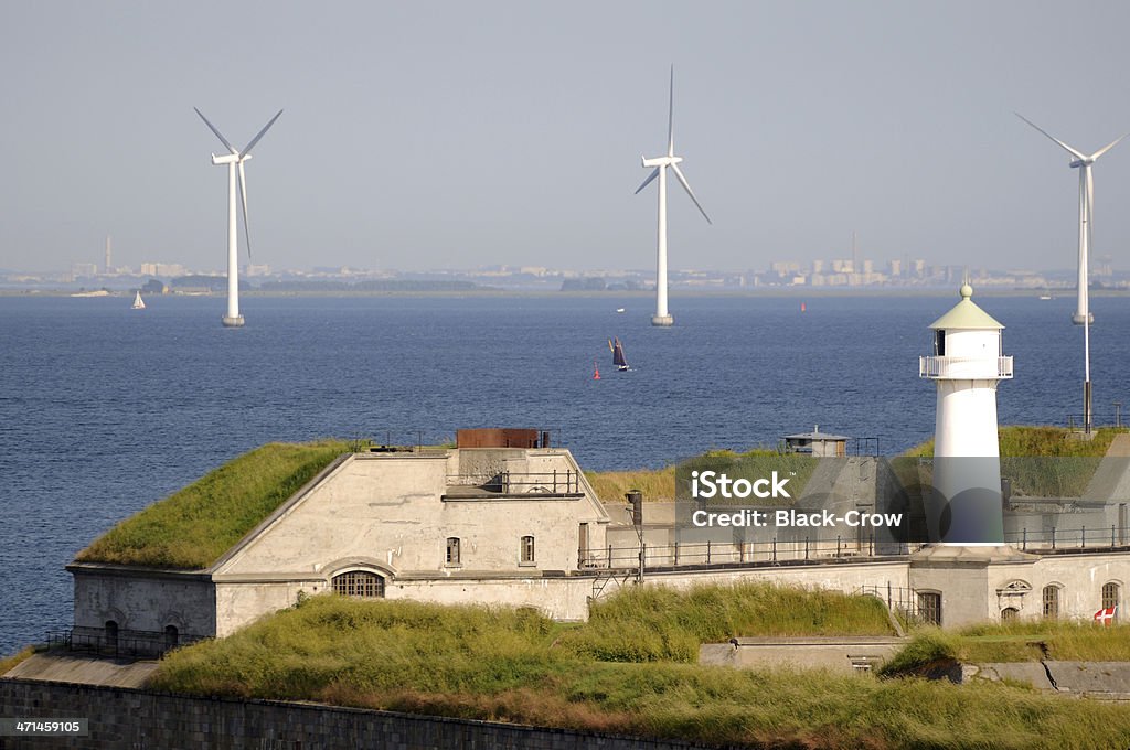 Wind power and Lighthouse Building Exterior Stock Photo