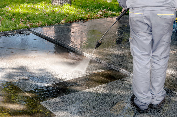 istock cleaning dirty streets with high pressure cleaner 471460486