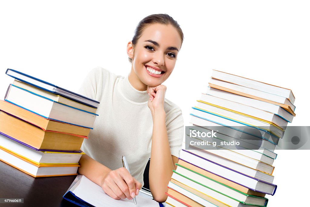 Writing woman with textbooks, isolated Writing woman with textbooks, isolated over white background Adult Stock Photo