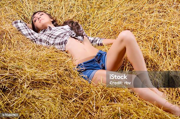 Girl Lying On Haystack Stock Photo - Download Image Now - 20-24 Years, 25-29 Years, Adult