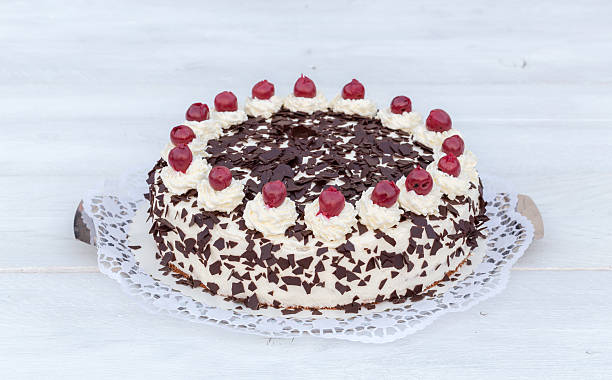 istock Black Forest cake on white wooden 471461200