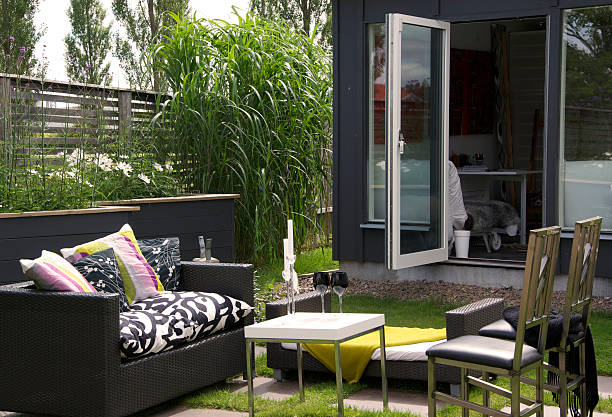 istock Modern Patio with outdoor sofas and a Garden Shed 471461743