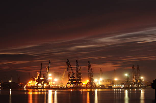 istock Sunset over an industry harbor with cranes in Bulgaria, Varna 471464432