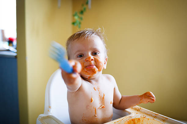 istock Cute baby boy eating lunch 471464487