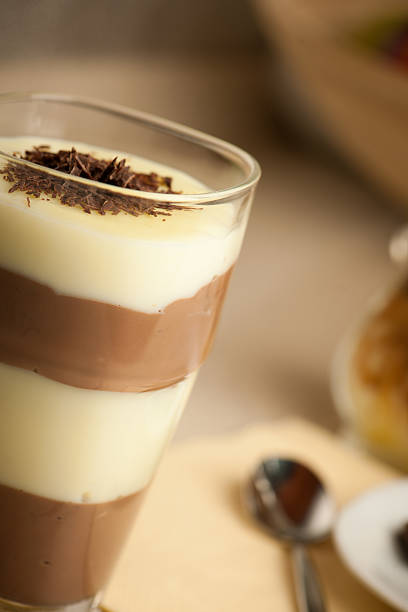 istock Mixed chocolate and vanilla pudding served in a glass decorated 471464506