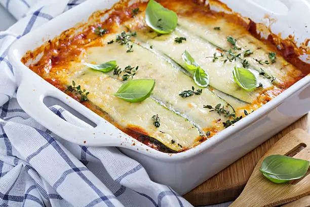 Healthy zucchini lasagna bolognese in a baking dish