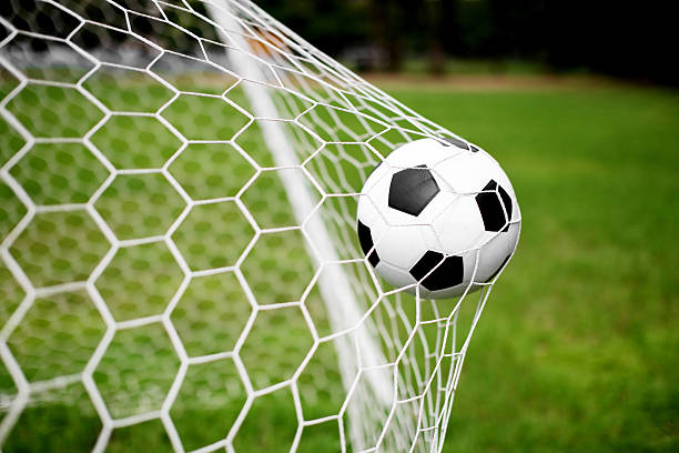 istock Goal net stretched by a scoring soccer ball 471466123