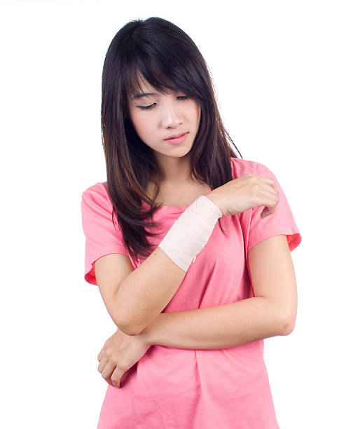 Injured  arm woman stock photo