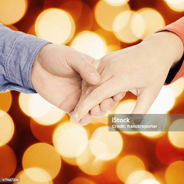 St Valentine Couple Holding Hand On Bokeh Light Stock Photo - Download Image Now - A Helping Hand, Active Lifestyle, Active Seniors