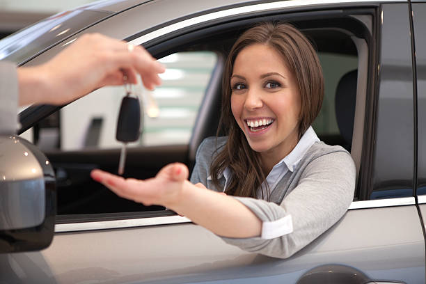 istock Woman buying car. 471467743