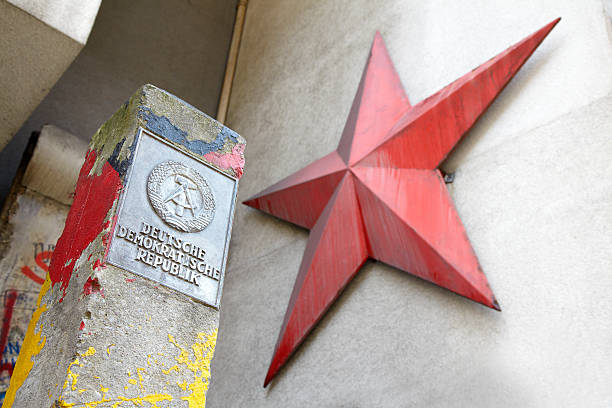 istock DDR sign and red star in east Berlin 471469209