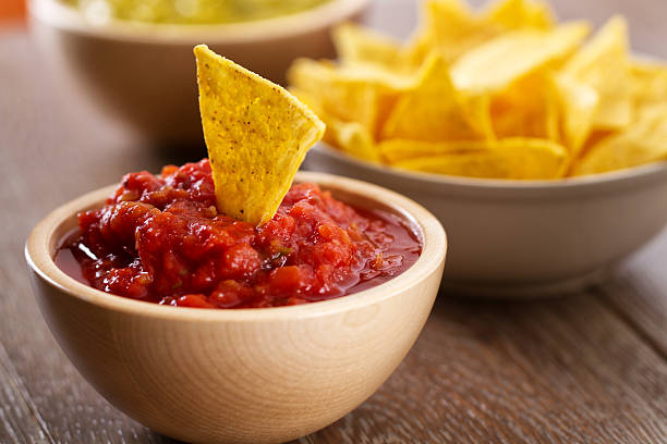 Nacho Chips with Salsa Nacho Chips with Salsa tortilla chip photos stock pictures, royalty-free photos & images