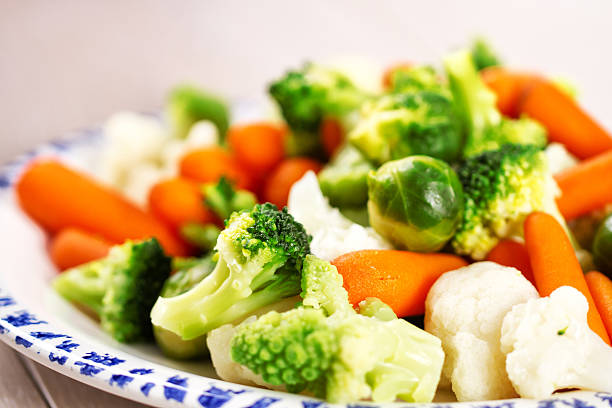 Mixed Vegetables On a Plate Mixed Vegetables On a Plate boiled stock pictures, royalty-free photos & images