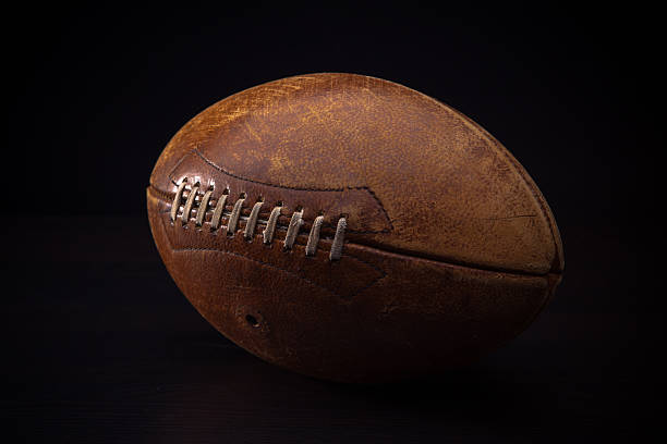 istock Old American Football on Black Background 471470149