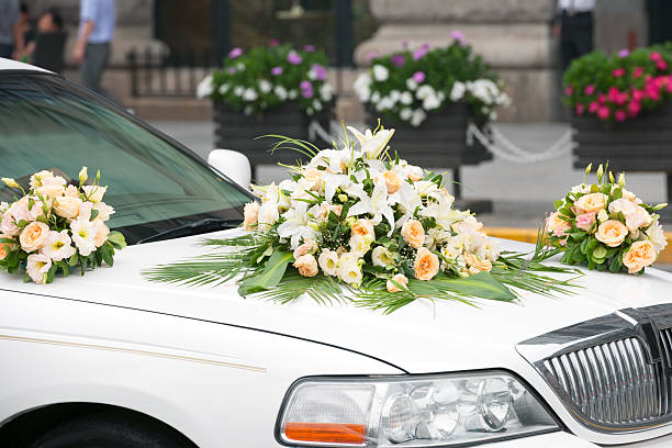 Red ribbon decoration on wedding car