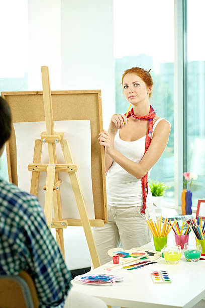 若いアーティスト - women artist painting easel ストックフォトと画像