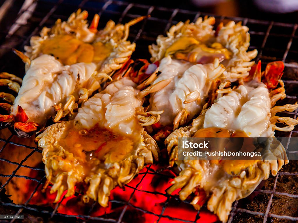 Prawn grilled. Grilled steak and jumbo prawns on a barbecue. 2015 Stock Photo