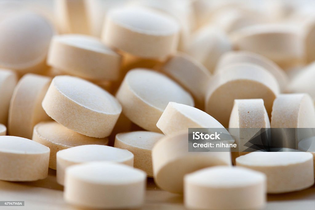 folic acid tablets a stack of folic acid tablets Folic Acid Stock Photo