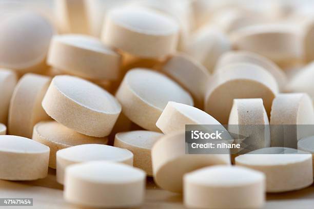 Folic Acid Tablets Stock Photo - Download Image Now - Folic Acid, Pill, Beige