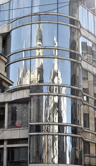 Window mirror on New York City skyscraper during summer day