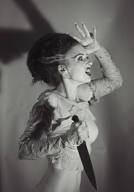 Out of time.Frankenstein`s Bride Emulation of vintage style photography, The Frankenstein`s Bride. Filters added for more vintage effect scary bride stock pictures, royalty-free photos & images