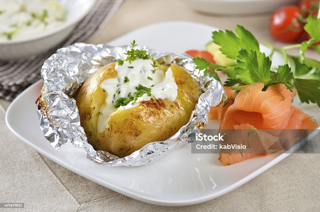 Baked potato Jacket potato with sour cream and smoked salmon Baked Potato Stock Photo