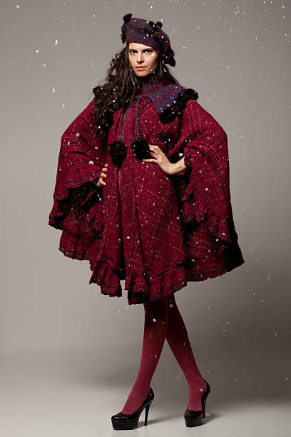 istock Beautiful young brunette posing in winter clothes 471471931
