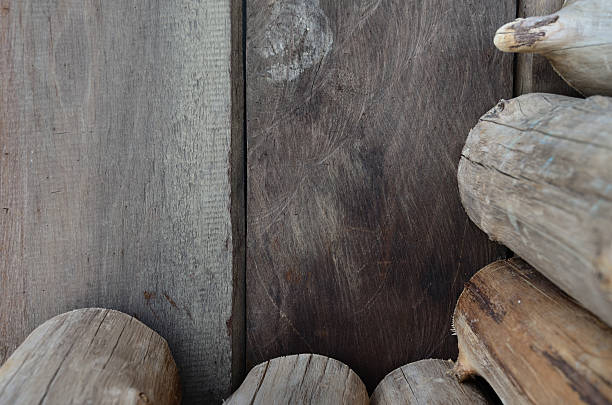istock Firewood logs and wall in barn. 471472977