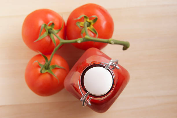 Home Made Tomato Ketchup with Vine Tomatoes stock photo