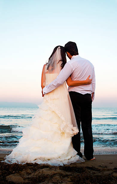 istock Newlywed couple on the coastline 471473631