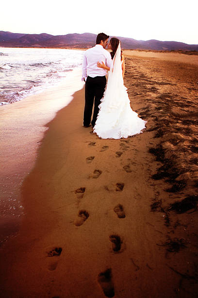 istock Newlywed couple on the coastline 471473639