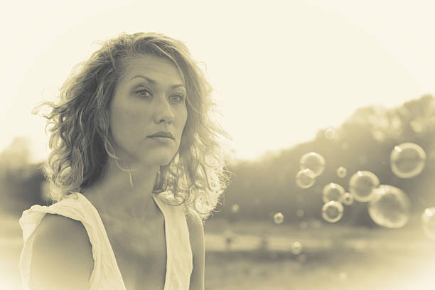 istock beautiful woman and sunbeams 471473855