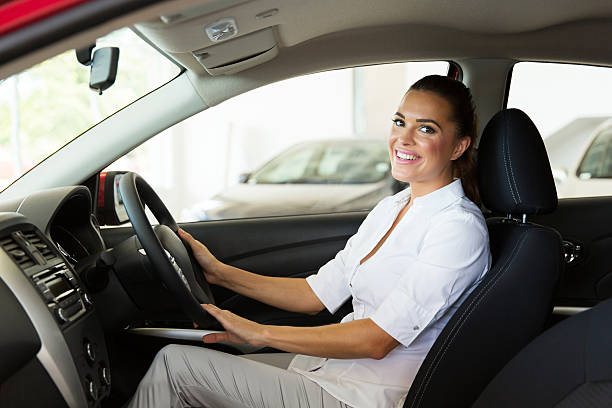 istock young businesswoman sitting inside the car 471474876