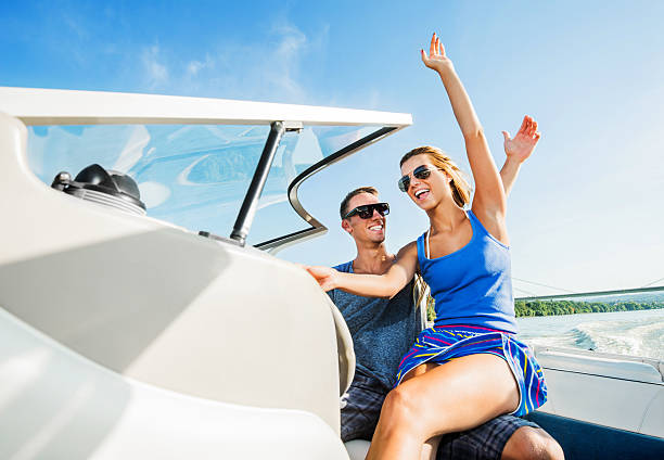 istock Beautiful couple riding a speedboat. 471474939