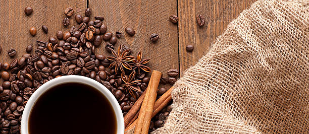 istock Cup of coffee on wooden table 471475258