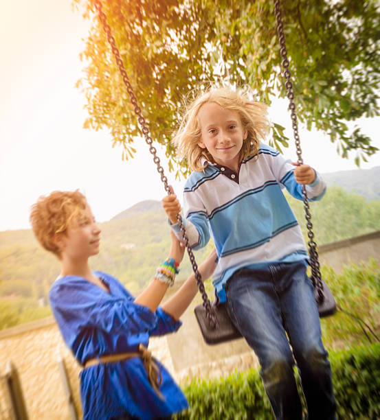 istock Children playing at the park 471475637