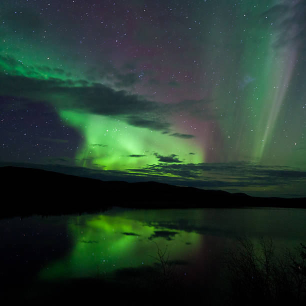 istock Night Sky Stars Clouds Northern Lights mirrored 471475831