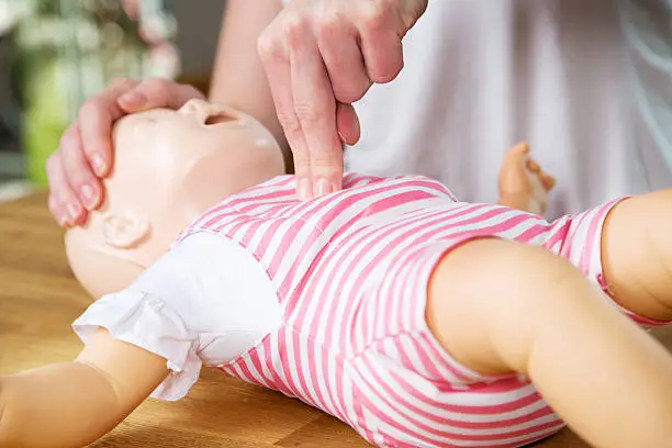 Photo of Infant CPR two finger cvompression