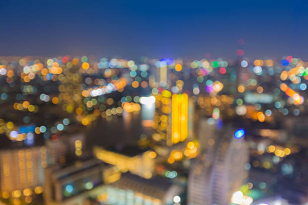 istock Blur bokeh lights background of city along river 471478338