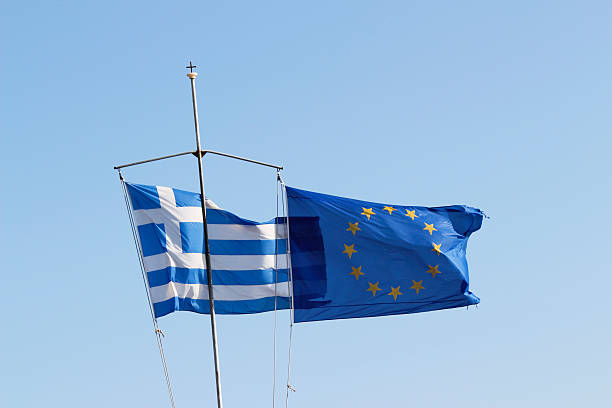 istock blue sky with greek  european flag 471478376