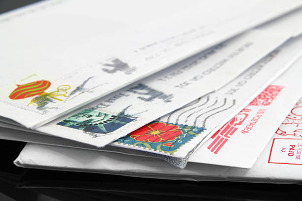 US Postage Close up of a stack of old, us letters with postage stamps. united states postal service photos stock pictures, royalty-free photos & images