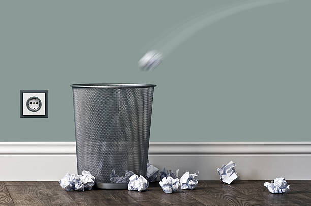 garbage office garbage near metal basket crumpled paper ball stock pictures, royalty-free photos & images