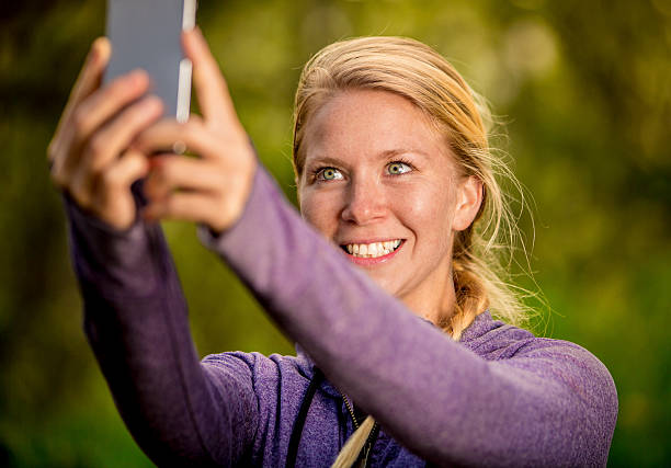 istock Happy Woman Posing for a Selfie in a Nature Setting 471478688