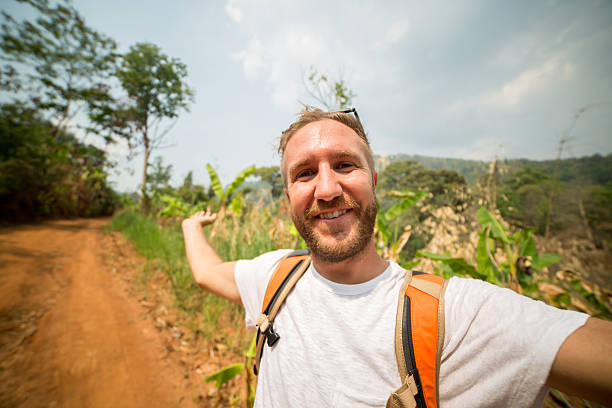 istock Happy traveler taking a selfie in nature 471478922