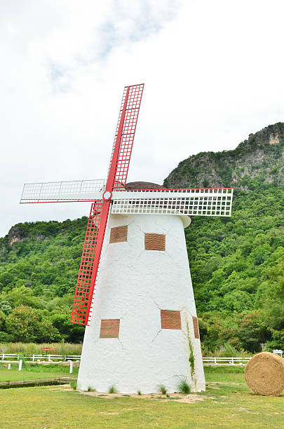 istock Wind turbine generating electricity on white building 471479167