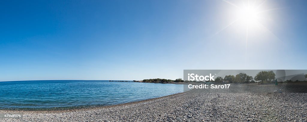 Final da tarde no Grameno Beach, Creta - Foto de stock de Barraca de Sol royalty-free