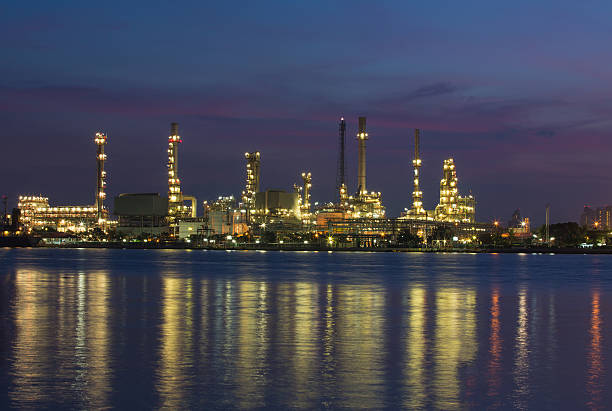 istock Petroleum oil refinery beside the river at twilight 471481817
