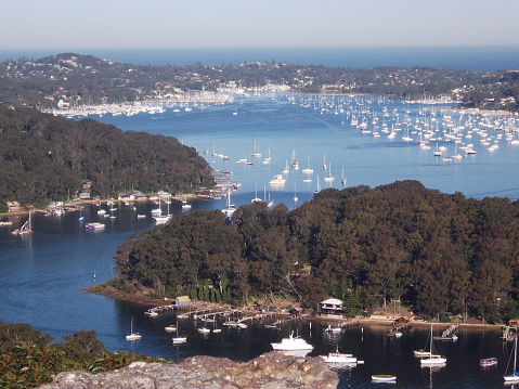 This is a photo of the boats and landscape at Pittwater, Australia